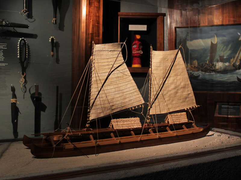 A museum exhibit inside the US Army Museum of Hawaii including a replica US Army sailboat.